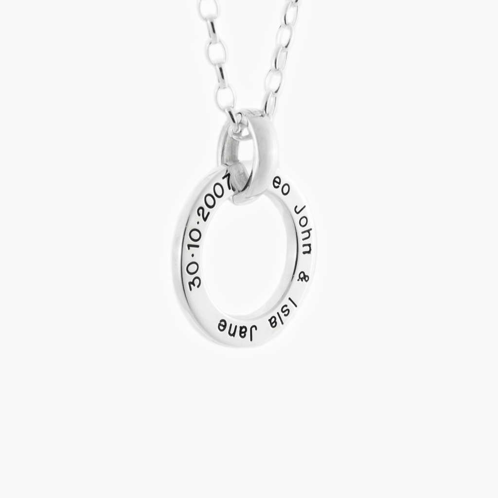 Wedding jewellery engraved with dates and names on a silver loop